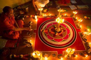 Durga Mata being invoked in the lamp during Her puja by Swami Nivedanananda. ©robert moses