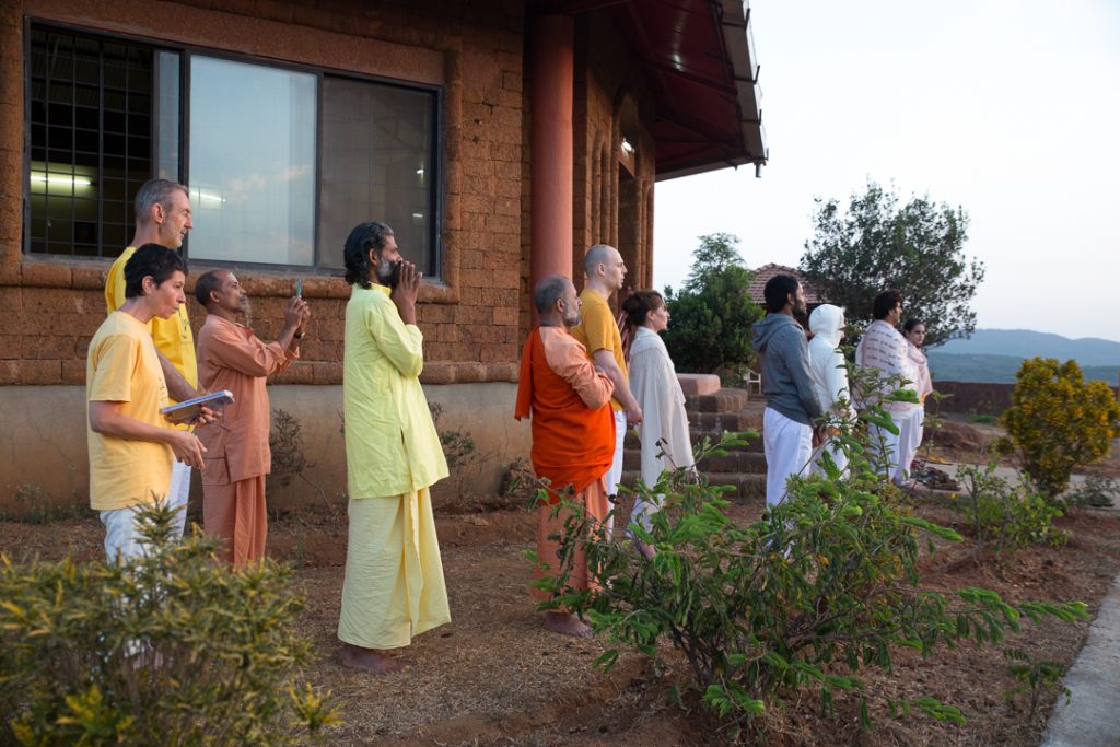 Repeating Gayatri Mantra while gazing at the sunrise. ©robertmoses
